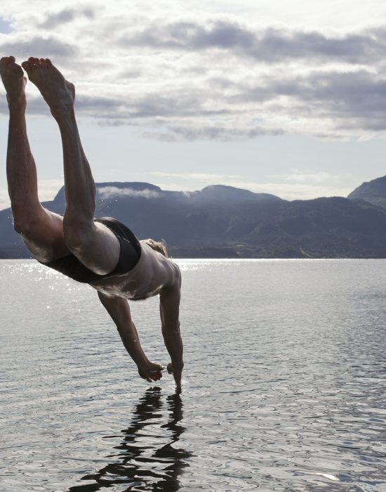 Man diving into water, Aure, Norway